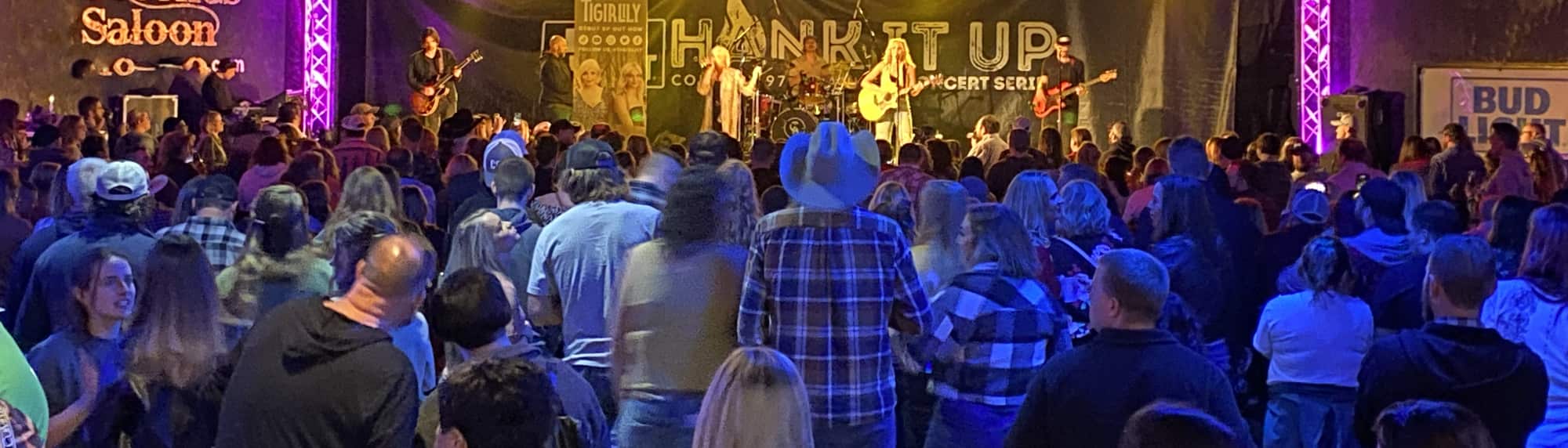 country concert with fans wearing cowboy hats Augusta