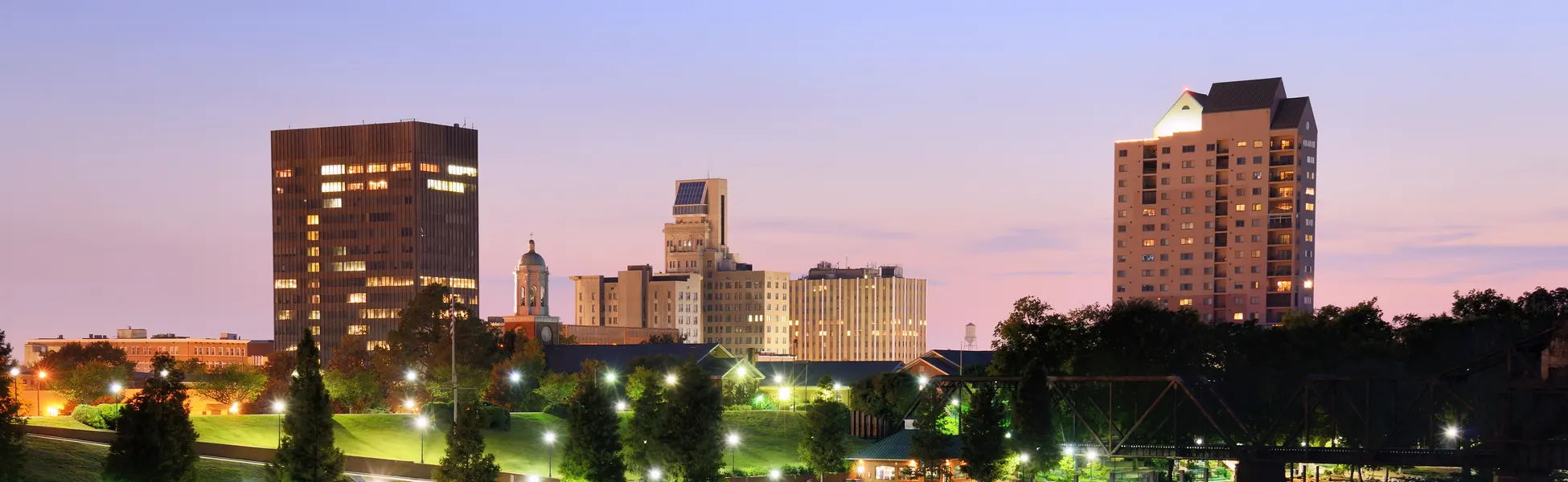 Neon color image of a band playing and people singing along