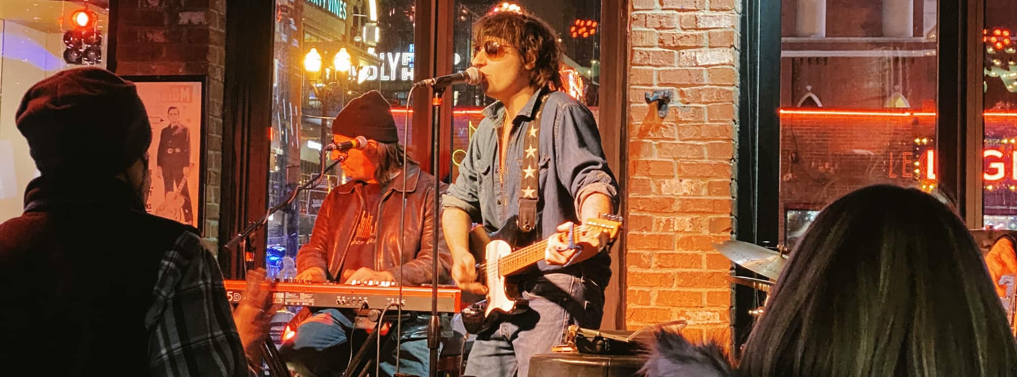 bar singer on guitar in Augusta